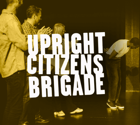“Upright Citizens Brigade” against a background of people standing on a stage, clapping.
