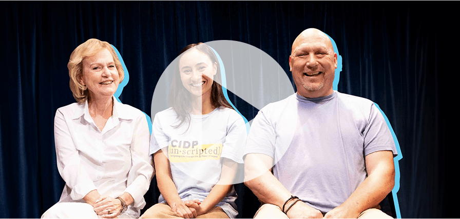 Two Shine Makers smiling with a member of the Upright Citizens Brigade 